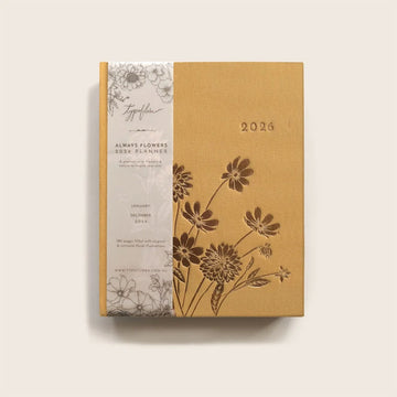 2026 planner with floral design on a beige background.