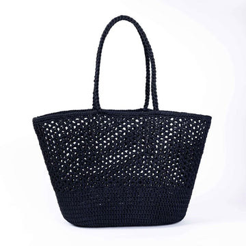 A woven black basket bag against a white background.