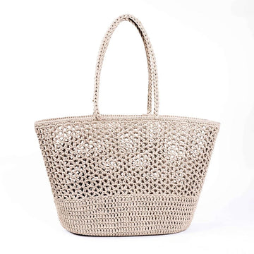Beige woven handbag on a white background.