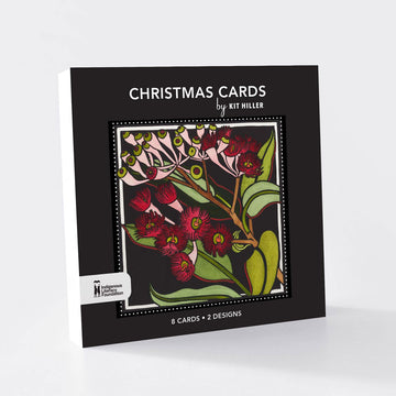 Box of Christmas cards with floral design and 'Kit Hiller' branding on a white background.