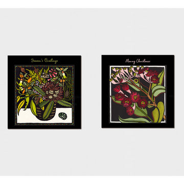 Box of Christmas cards with floral design and 'Kit Hiller' branding on a white background.