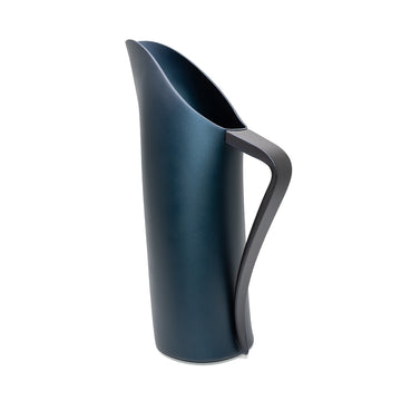 A stainless steel jug in a dark blue satin colour with a black handle.