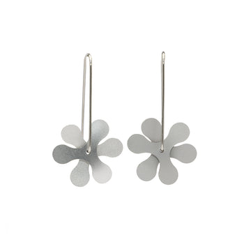 A pair of silver drop earrings in a curved propeller shape design.