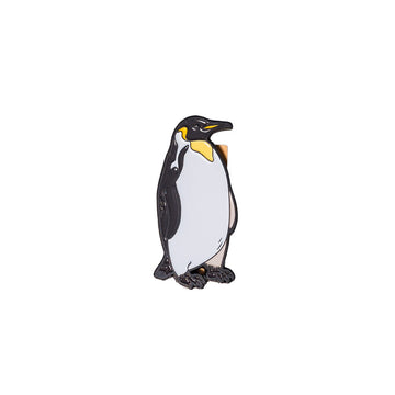 Penguin shaped metal magnet on a white background.