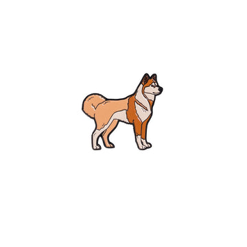 A metal magnet shaped like a brown dog.