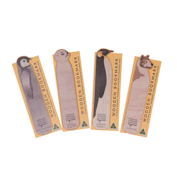 Wooden bookmark shaped like a seal pup with packaging on a white background.