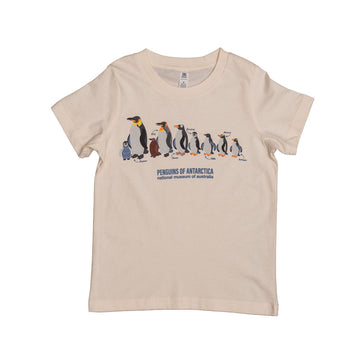 Beige t-shirt with penguin design and text on a white background.