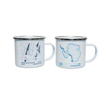 White mug with blue topographic design on a white background.
