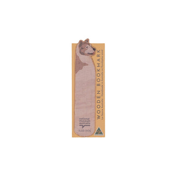 Wooden bookmark with dog design on a white background.