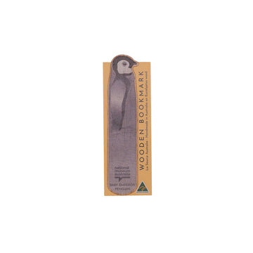 Wooden bookmark with penguin design on a white background.