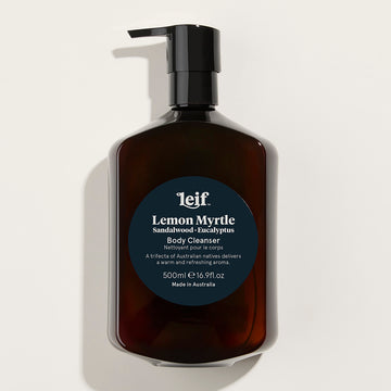 A clear pump bottle filled with brown liquid and the title 'Lemon Myrtle Body Cleanser' on the front.