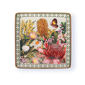 Decorative square trinket tray with floral design on a white background.