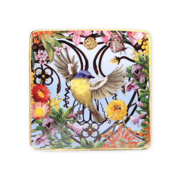 Decorative square trinket tray with a bird and floral design on a white background.