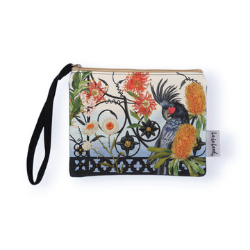 Wristlet pouch with a design of a bird and flowers on a white background.