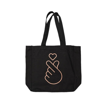 Black tote bag with a pink hand sign and heart design on a white background.