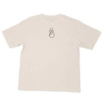 Beige t-shirt with an embroidered black hand and red heart design on a white background.