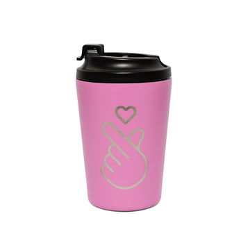 Pink travel mug with black lid and hand symbol design on a white background.