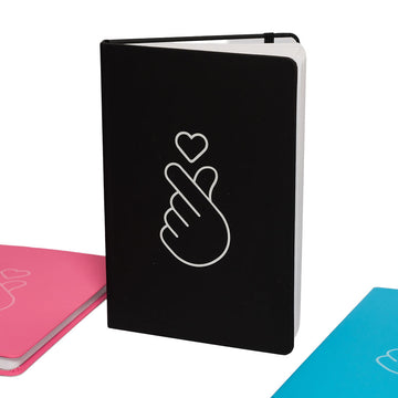 Black notebook with a white hand and heart design on a white background.