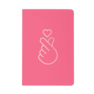 Pink notebook with a white outline of a hand making a heart and a heart symbol on a white background.
