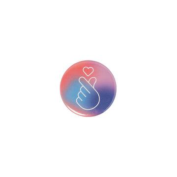 Round button badge with a white hand and a heart symbol on a gradient pink and blue background.
