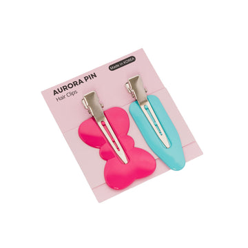 Two hair clips, one pink and one blue, on a pink card with 'Aurora Pin' branding.