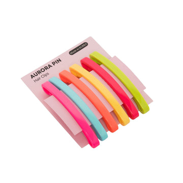 Set of colorful hair clips in a pink packaging on a white background.
