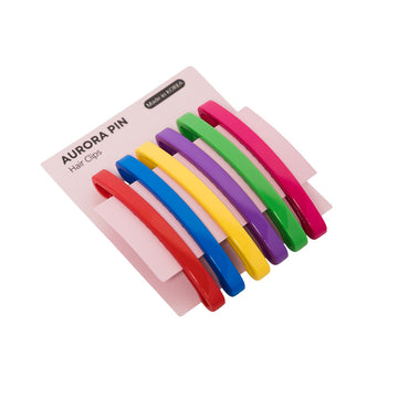 Set of colorful hair clips in a pink packaging on a white background.