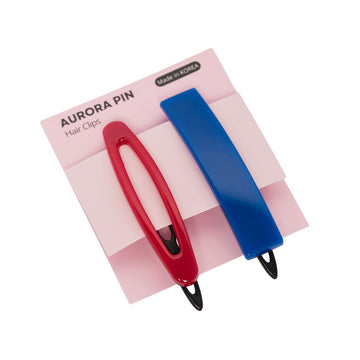 Red and blue hair clips on a pink and white checkered card with 'Aurora Pin' branding.