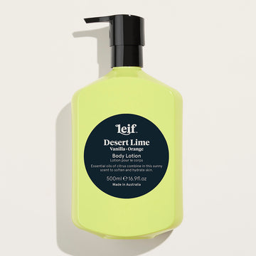 A yellow bottle with a black pump lid and a dark teal circle in the middle. The text 'Leif Desert Lime Vanilla Orange Body Lotion' is visible in white in the circle along with more product information.