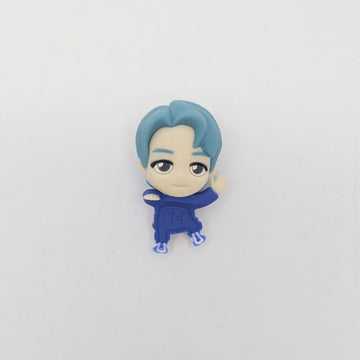 Small figurine of a character with blue hair and outfit on a white background.