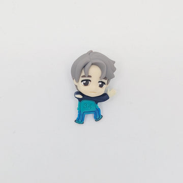 Character figurine with gray hair and blue outfit on a light gray background.