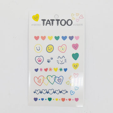 Sheet of colorful temporary tattoos with various designs on a white background