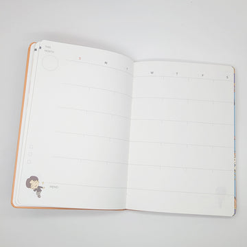 Notebook with cartoon character and text on a white background.