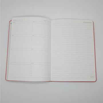 Red notebook cover with a character and text on a red background.