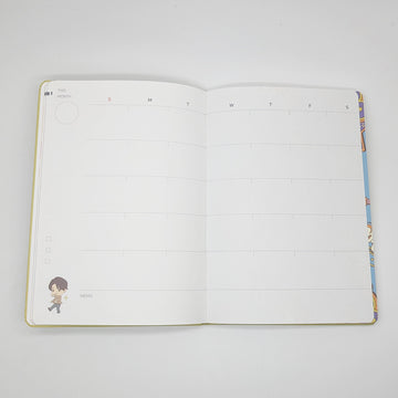 Notebook with cartoon character and colorful graphics on a white background.
