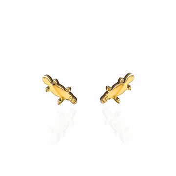 A pair of gold stud earrings shaped like platypuses. 
