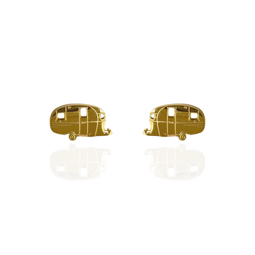 A pair of gold stud earrings shaped like a caravan.
