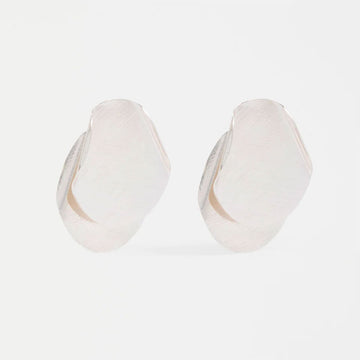 Pair of silver hoop earrings on a light gray background.