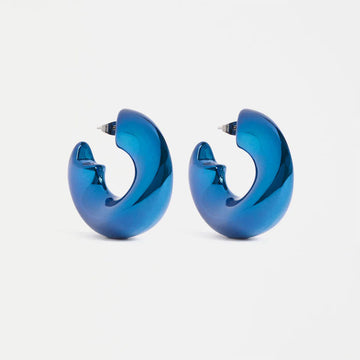 Blue hoop earrings on a light gray background.