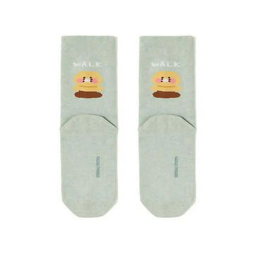 Pair of mint coloured socks with cartoon character and 'WALK' text on a white background.