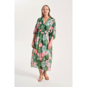 A dress printed with a pink and green floral print.