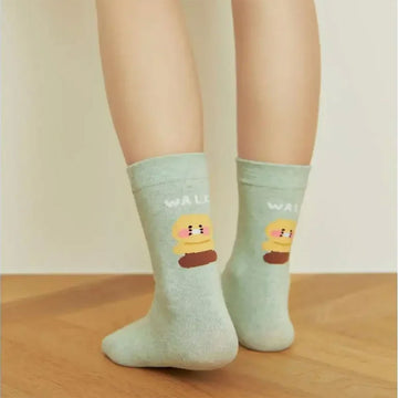 Pair of mint coloured socks with cartoon character and 'WALK' text on a white background.