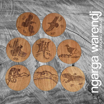 A set of eight round wooden coasters each etched with a different animal or bird.