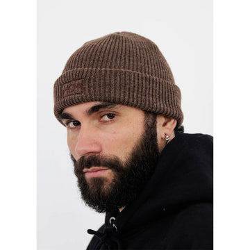 Close up of a model wearing a brown beanie with a black jumper.