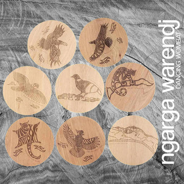A set of eight round wooden coasters each etched with a different animal or bird.