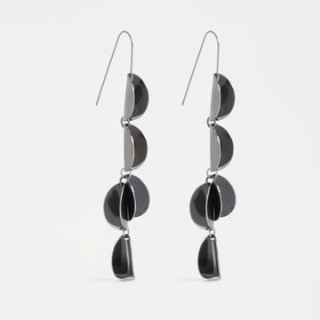 Pair of gunmetal grey earrings with a scalloped design on a white background.