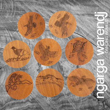 A set of eight round wooden coasters each etched with a different animal or bird on it.