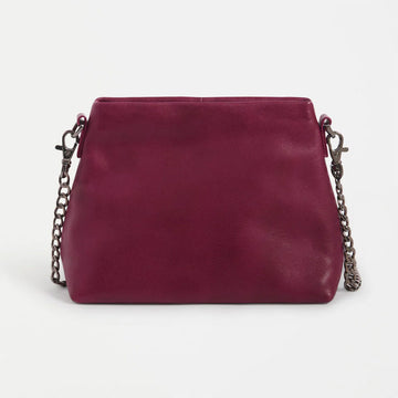 Maroon handbag with chain strap on a white background.