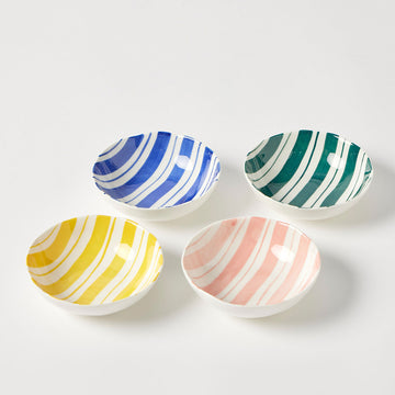 Four colorful striped ceramic bowls on a white background.