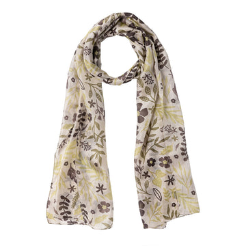 A silk scarf printed with leaves and flowers in a natural colour scheme.